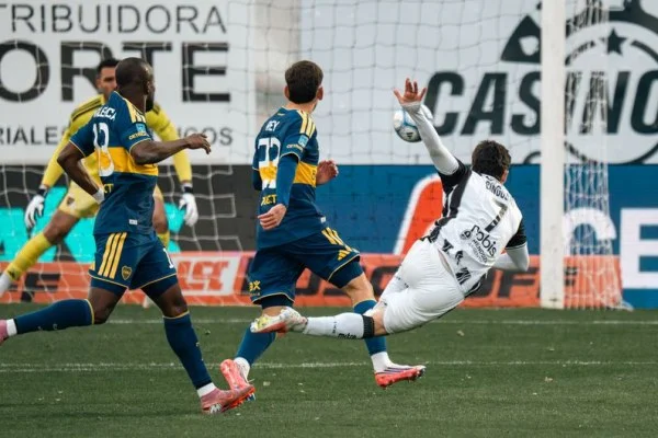 soccer striker shooting goal