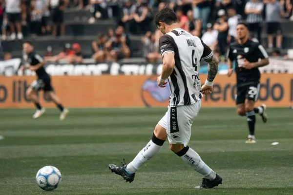 soccer midfielder passing ball